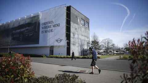 OXFORD, ENGLAND - MARCH 13: Workers walk through the BMW Mini assembly plant in Cowley on March 13, 2017 in Oxford, England. Following a vote on the Brexit bill in Parliament today, British Prime Minister Theresa May could trigger article 50 as soon as tomorrow, March 14th, which would start the formal process of leaving the European Union. German manufacturer of the Iconic Mini has said some production of the electric powered Mini could be moved to Germany becuase of Brexit uncertainty. (Photo by Christopher Furlong/Getty Images)