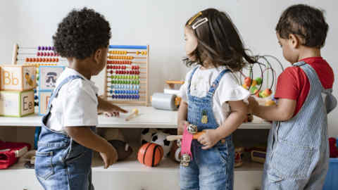 Young children playing with educational toys