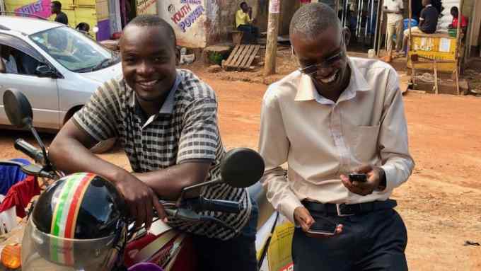First Access - loan for the motorbike driver, and the other guy who is standing is a loan officer for a financial institution called UGAFODE that uses First Access software to do digital loan origination in Uganda