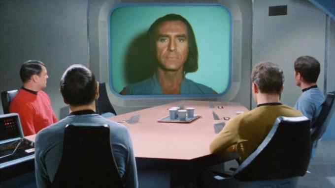 LOS ANGELES - FEBRUARY 16: on screen is Ricardo Montalban as Khan Noonien Singh (a genetically engineered human from the 20th century). At table from left is James Doohan as Lt. Commander Montgomery Scotty Scott, Leonard Nimoy as Commander Spock (Mr. Spock), William Shatner as Captain James T. Kirk and DeForest Kelley as Dr. Bones McCoy in the Star Trek: The Original Series episode, &quot;Space Seed.&quot; Original air date February 16, 1967. Image is a frame grab. (Photo by CBS via Getty Images)