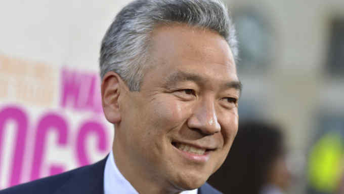 FILE - In this Aug. 15, 2016 file photo, Kevin Tsujihara, chairman and CEO, Warner Bros. Entertainment, arrives at the Los Angeles premiere of &quot;War Dogs.&quot; Tsujihara is stepping down after claims that he promised acting roles in exchange for sex. As Warner Bros. chairman and chief executive officer at one of Hollywood‚Äôs most powerful and prestigious studios, Tsujihara is one of the highest ranking executives to be felled by sexual misconduct allegations. (Photo by Jordan Strauss/Invision/AP, File)