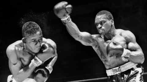 Rubin 'Hurricane' Carter, right, in the ring with George Benton in 1963