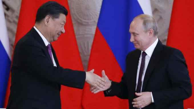 Russian President Vladimir Putin, right, and Chinese President Xi Jinping shake hands after a signing ceremony following their talks in the Kremlin in Moscow, Russia, Wednesday, June 5, 2019. Chinese President Xi Jinping is on visit to Russia this week and is expected to attend Russia's main economic conference in St. Petersburg. (AP Photo/Alexander Zemlianichenko, Pool)