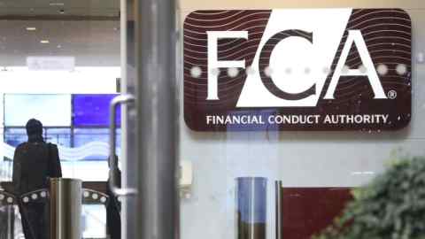 A logo sits on display in the offices of the Financial Conduct Authority (FCA) in the Canary Wharf business district in London, U.K., on Thursday. Nov. 21, 2013. The FCA is working with regulators including the U.S. Department of Justice and the Commodity Futures Trading Commission to investigate the potential manipulation of the foreign-exchange market. Photographer: Chris Ratcliffe/Bloomberg