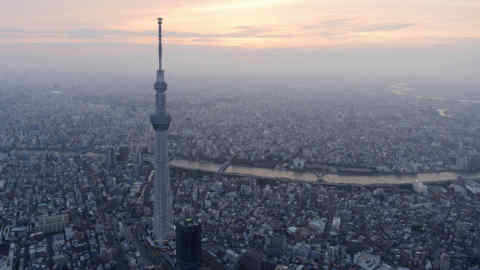 A view of Tokyo Skytree, the world's tallest broadcasting tower at 634 metres (2080 feet), in Tokyo...A view of Tokyo Skytree, the world's tallest broadcasting tower at 634 metres (2080 feet), in Tokyo in this photo taken by Kyodo on May 21, 2012. The tower opened to the public on Tuesday, with hundreds of people entering the tower and its large shopping mall. Picture taken May 21, 2012. Mandatory Credit REUTERS/Kyodo (JAPAN - Tags: BUSINESS CONSTRUCTION SOCIETY MEDIA TPX IMAGES OF THE DAY) FOR EDITORIAL USE ONLY. NOT FOR SALE FOR MARKETING OR ADVERTISING CAMPAIGNS. THIS IMAGE HAS BEEN SUPPLIED BY A THIRD PARTY. IT IS DISTRIBUTED, EXACTLY AS RECEIVED BY REUTERS, AS A SERVICE TO CLIENTS. MANDATORY CREDIT. JAPAN OUT. NO COMMERCIAL OR EDITORIAL SALES IN JAPAN. YES