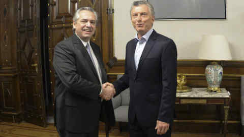 In this handout photo provided by Argentina's presidential press office, presidential candidate Alberto Fernandez, left, shakes hands with Argentina's President Mauricio Macri at Government House in Buenos Aires, Argentina, Monday, Oct. 28, 2019.Â Argentina's Peronists are celebrating their return to power after incumbent Macri conceded defeat in a dramatic election that likely swung the country back to the center-left and threatened to rattle financial marketsÂ (Presidencia de la Nacion via AP)