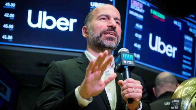 Dara Khosrowshahi, chief executive officer of Uber Technologies Inc., speaks on a webcast during the company's initial public offering (IPO) on the floor of the New York Stock Exchange (NYSE) in New York, U.S., on Friday, May 10, 2019. Uber fell in its trading debut, leaving the company's market value below its last private funding round. Photographer: Michael Nagle/Bloomberg