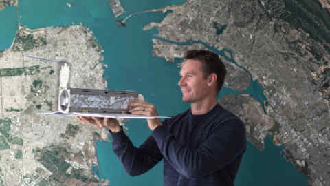 Robbie Schingler, one of Planet’s founders, with his 5kg 'Dove' microsatellite at the company’s Berlin office