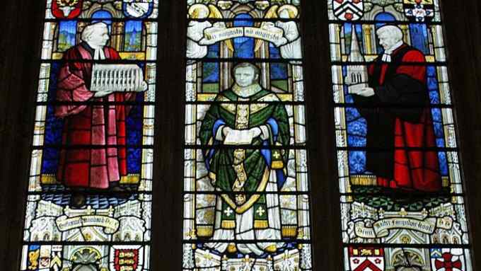 Anglican priest John Mason Neale, as depicted in a stained glass window, centre, at St Swithuns East Grinstead, West Sussex. Neale wrote 'Good King Wenceslas' in 1853