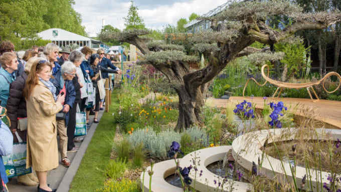 Visitors look at The Royal Bank of Canada Garden designed by Matthew Wilson at the RHS Chelsea Flower Show 2015.