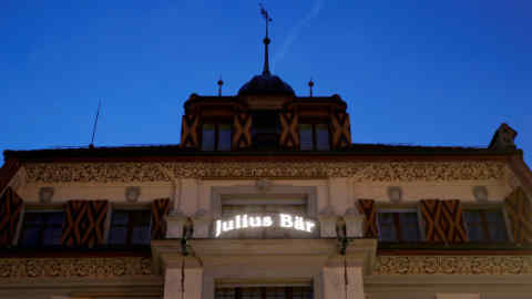 FILE PHOTO: The sign for Swiss bank Julius Baer is seen at a branch office in Luzern, Switzerland, November 23, 2017. REUTERS/Arnd Wiegmann/File Photo