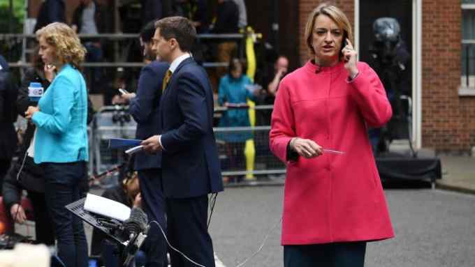 BBC political editor Laura Kuenssberg waits for Britain's Prime Minister and leader of the Conservative Party Theresa May to deliver a statement outside 10 Downing Street in central London on June 9, 2017 as results from a snap general election show the Conservatives have lost their majority. British Prime Minister Theresa May faced pressure to resign on June 9 after losing her parliamentary majority, plunging the country into uncertainty as Brexit talks loom. The pound fell sharply amid fears the Conservative leader will be unable to form a government and could even be forced out of office after a troubled campaign overshadowed by two terror attacks. / AFP PHOTO / Justin TALLIS (Photo credit should read JUSTIN TALLIS/AFP/Getty Images)