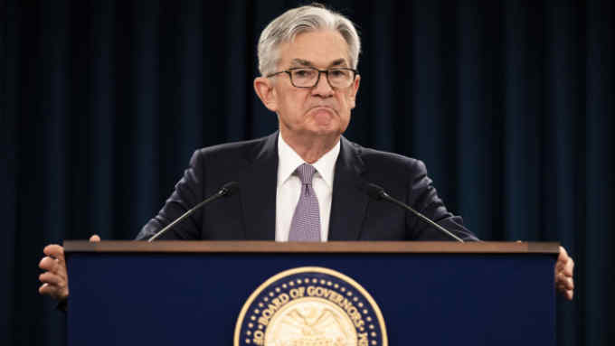 FILE - In this Jan. 29, 2020 file photo, Federal Reserve Chair Jerome Powell pauses during a news conference in Washington. The Federal Reserve is taking additional steps to provide up to $2.3 trillion in loans to suport American households and businesses as well as local governments as they deal with the coronavirus. The Fed said Thursday, April 9, among the actions it is taking is the activation of a Main Street Lending Program that was authorized by the $2.3 trillion economic relief bill pass by Congress last month.(AP Photo/Manuel Balce Ceneta, File)