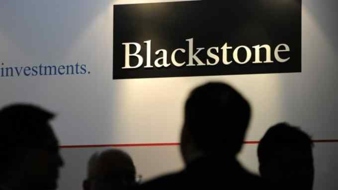 Blackstone Group CEO Stephen Schwarzman and CFO Laurence Tosi Attend Opening of Singapore Office...The logo for Blackstone Group LP is displayed during the opening of the company's new office in Singapore, on Monday, Oct. 21, 2013. Blackstone, the world's biggest manager of alternative assets such as private equity and real estate, last week reported that third-quarter profit rose 3 percent as gains in property holdings offset a decline in its buyout unit. Photographer: Munshi Ahmed/Bloomberg