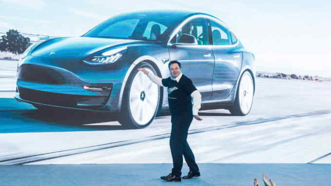 2AK868H Beijing, China. 7th Jan, 2020. Tesla CEO Elon Musk gestures at a delivery ceremony for Tesla China-made Model 3 in Shanghai, east China, Jan. 7, 2020. U.S. electric carmaker Tesla officially launched its China-made Model Y program in its Shanghai gigafactory Tuesday, one year after the company broke ground on its first overseas plant. The first batch of China-produced Model 3 sedans was also delivered to its non-employee customers at an opening ceremony for the program. Credit: Ding Ting/Xinhua/Alamy Live News