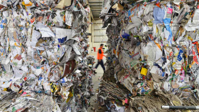TOPSHOT - This photo taken on April 17, 2019 shows recycled paper at the Northern Adelaide Waste Management Authority's recycling site in Edinburgh, near Adelaide. - From grubby packaging engulfing small Southeast Asian communities to waste piling up in plants from the US to Australia, China's ban on accepting the world's used plastic has plunged global recycling into turmoil. (Photo by Brenton EDWARDS / AFP) / TO GO WITH Environment-waste-Malaysia-China-Australia, FOCUS by Sam Reeves and Poornima Weerasekara (Photo credit should read BRENTON EDWARDS/AFP/Getty Images)