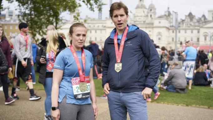 Laura Noonan and Patrick McGee, FT correspondents, photographed in St.James' Park after finishing the London Marathon London. 28 April, 2019