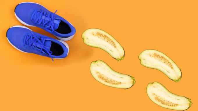 Top view blue running shoes on orange pastel background; Shutterstock ID 1627591840; Department: -; Job/Project: -; Employee Name: -