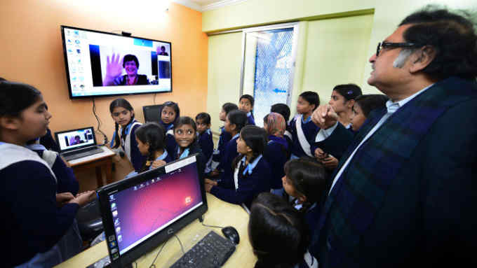 Making connections: Sugata Mitra (right) at the launch of School in the Cloud at a government-run girls school New Delhi