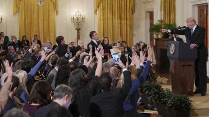 US President Donald Trump points to journalist Jim Acosta(CenterL) from CNN during a post-election press conference in the East Room of the White House in Washington, DC on November 7, 2018. (Photo by Mandel NGAN / AFP)MANDEL NGAN/AFP/Getty Images