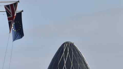 A British Union Jack flag and an European Union flag fly from a building, with the 'Gherkin' skyscraper seen in the City of London financial district in London, Britain, January 30, 2016. More Britons support the country's membership of the European Union than want to leave the bloc, the latest opinion poll on the issue showed on Saturday, even as opposition to membership grew slightly compared with last month's survey. REUTERS/Toby Melville - LR2EC1U12MHT2
