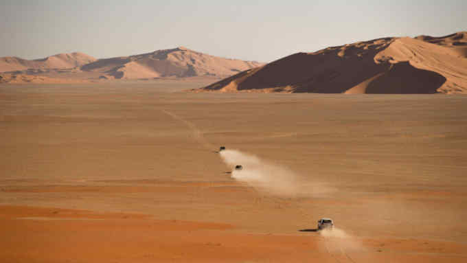 Driving across the dunes of the Rub al-Khali, the Empty Quarter, near the Saudi Arabia border