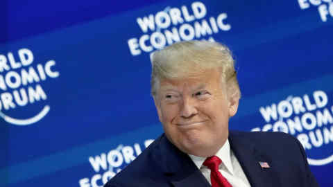 U.S. President Donald Trump reacts as he delivers a speech during the 50th World Economic Forum (WEF) annual meeting in Davos, Switzerland, January 21, 2020. REUTERS/Denis Balibouse