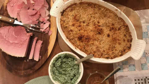 Cannellini bean gratin and gammon with a parsley sauce