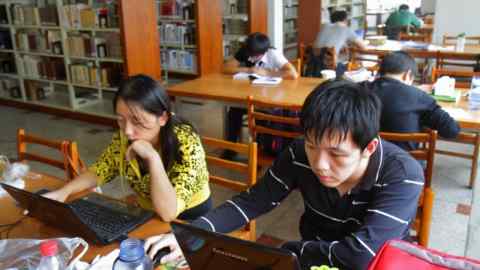 Tongji University, Siping Campus, student library, studying tables. (Photo by: Jeffrey Greenberg/UIG via Getty Images)