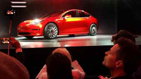 FILE PHOTO: A Tesla Model 3 sedan, its first car aimed at the mass market, is displayed during its launch in Hawthorne, California, U.S. March 31, 2016. REUTERS/Joe White/File Photo