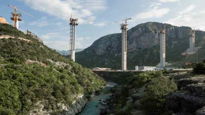 Cement pillars above Moraca river canyon are seen at a bridge construction site of the Bar-Boljare highway in Bioce, Montenegro June 18, 2018. Picture taken June 18, 2018. To match Insight: CHINA-SILKROAD/EUROPE-MONTENEGRO REUTERS/Stevo Vasiljevic - RC1159CE3C10