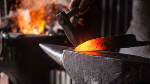 A blacksmith works on a knife in 'Metal', one of three documentaries in the 'Handmade' series