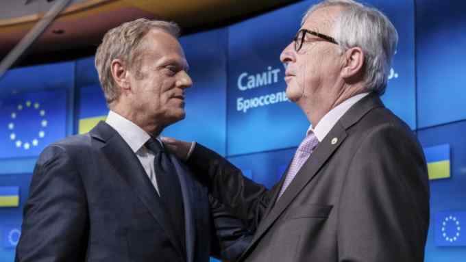 epa06875731 European Union Council President Donald Tusk (L) and European commission President Jean-Claude Juncker (R) during a news conference with President of Ukraine Petro Poroshenko, (not pictured) in Brussels, Belgium, 09 July 2018. Donald Tusk gave EU leaders reaction to British Foreign Affairs ministers Borris Johnson resignation following the resignation of United Kingdom's Secretary of State for Exiting the European Union, David Davis the previous day. EPA/OLIVIER HOSLET