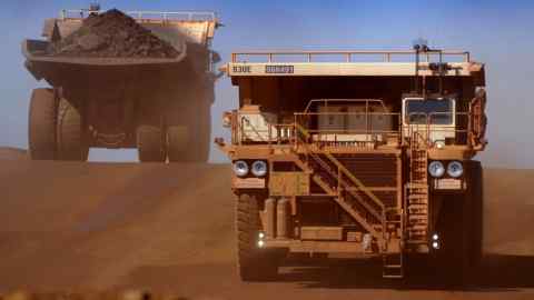 26 July, 2006 - PIC: JACK ATLEY/ BLOOMBERG NEWS - STORY: RIO TINTO MINE - PIC SHOWS: Heavy earth moving trucks are seen inside the Tom Price Iron Ore mine, operated by Rio Tinto, in north Western Australia, Australia, Wednesday 26 July, 2006. Photographer: Jack Atley/Bloomberg News.