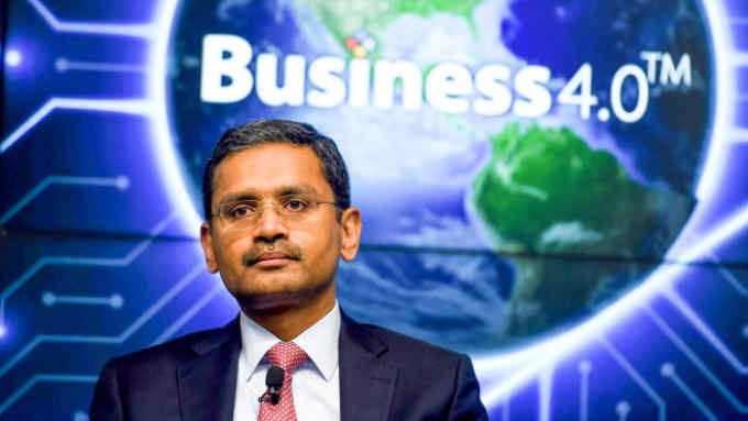 India's Tata Consultancy Services (TCS) CEO and Managing Director Rajesh Gopinathan speaks during a press conference after the announcement of the financial results of the company in Mumbai on April 12, 2019. - India's biggest software exporters reported a surge in net profits on Friday thanks to strong revenue growth and a slew of big new deals. (Photo by PUNIT PARANJPE / AFP) (Photo credit should read PUNIT PARANJPE/AFP via Getty Images)