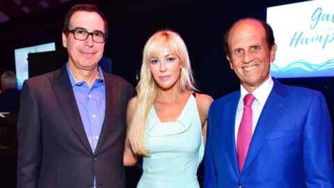 WATER MILL, NY - AUGUST 25: United States Secretary of the Treasury Steven Mnuchin, Louise Linton and Mike Milken attend the 14th Annual Prostate Cancer Foundation's Gala In The Hamptons With A Special Performance By John Fogerty at the Parrish Art Museum on August 25, 2018 in Water Mill, New York. (Photo by Sean Zanni/Patrick McMullan via Getty Images)