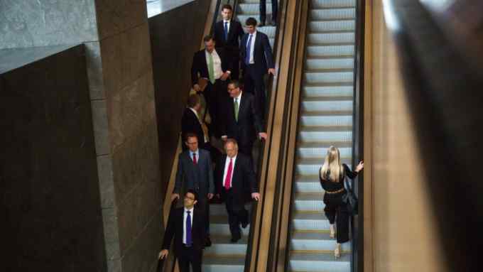 Guests ride escalators during the opening of Coach Inc.'s new offices at 10 Hudson Yards in New York, U.S., on Tuesday, May 31, 2016. The first skyscraper at Related Cos.'s $25 billion Hudson Yards project opened Tuesday after three and a half years of construction, bringing office workers to a once-desolate area of Manhattan's far west side that's now transforming into a new business enclave. Photographer: Michael Nagle/Bloomberg