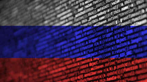 T505R8 Russia flag is depicted on the screen with the program code. The concept of modern technology and site development.
