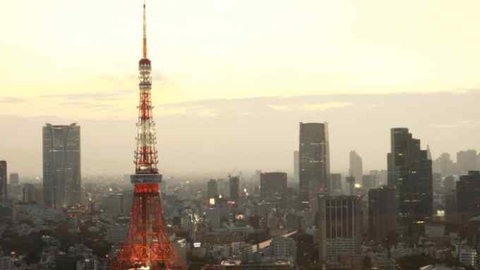Japan Economy Expands 3.7%...The Tokyo Tower is lit up after dusk in central Tokyo, Japan, on Friday, Aug. 14, 2009. Japan's economy grew for the first time in five quarters as a revival in exports and consumer spending helped the country climb out of its worst postwar recession. Photographer: Tomohiro Ohsumi/Bloomberg