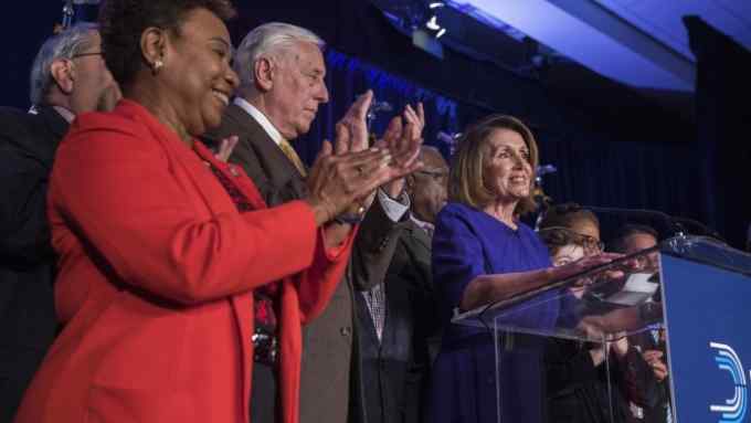 Mandatory Credit: Photo by ERIK S LESSER/EPA-EFE/REX/Shutterstock (9969037u) Democratic House Minority leader from California Nancy Pelosi (R) reacts with other House of Representatives Democrats to returns from the 2018 midterm general election during a House Democratic Election Night event at the Hyatt Regency in Washington, DC, USA, 06 November 2018. House Democratic leaders watch 2018 midterm election returns in Washington, DC, USA - 06 Nov 2018