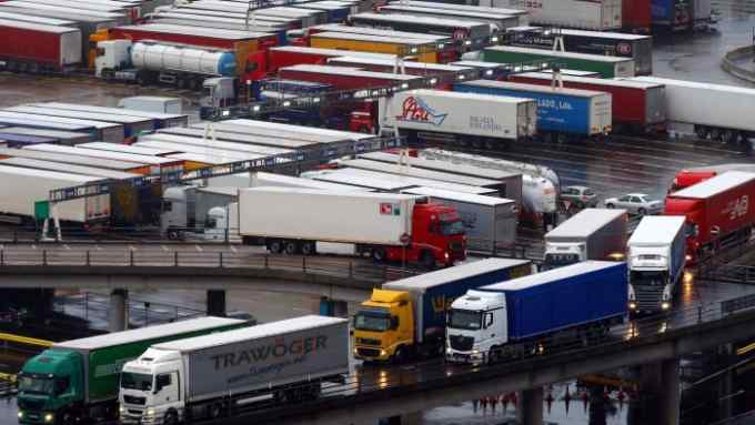 Lorries queue to board ferries at The Port of Dover in Kent, as bad weather continues to delay ferry crossings across The Channel.