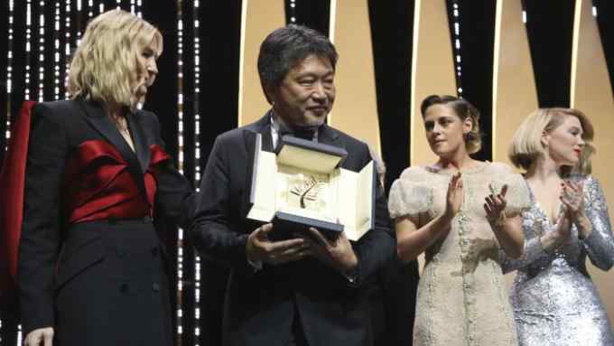 Palme d'Or winner Hirokazu Kore-eda, centre, with jury president Cate Blanchett, left, and jury members Kirsten Stewart, second from right, and Lea Seydoux