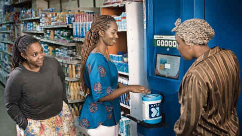 A customer in Nairobi tops-up on clean fuel at a 'KOKOpoint' Fuel ATM. There are 700 KOKO Agents across the city. (handout)