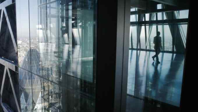 Bloomberg Photo Service 'Best of the Week': The glass windows of the Leadenhall Building, also known as the Cheesegrater, reflect the neighboring skyscraper at 30 St Mary Axe, also known as the Gherkin, left, in the financial district of London, U.K., on Wednesday, Sept. 3, 2014. Rents for skyscrapers with nicknames like the Walkie Talkie and Cheesegrater rose faster than the rest of the financial district in the last three years, rewarding developers who started construction at a time when the economy was shrinking. Photographer: Simon Dawson/Bloomberg