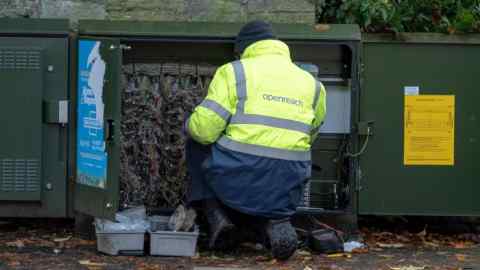 2A84RW3 Openreach Engineer working at a telephone exchange box in West Lothian, Scotland.