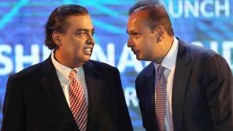 epa04826786 Chairman Reliance Industries Limited, Mukesh Ambani (L) and his brother and Chairman of Reliance Anil Dhirubhai Ambani Group, Anil Ambani attend the launching of the 'Digital India Week' in New Delhi, India, 01 July 2015. Prime minster Modi launched Digital India Week to extend better services and to empower the people of India with the use of information and technology with various phone apps. EPA/HARISH TYAGI