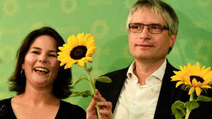 Co-leader of the Green party Annalena Baerbock and German Greens party top candidate Sven Giegold celebrate on stage with sunflowers after exit poll were announced on public broadcast TV stations during the election evening on May 26, 2019 in Berlin following the European parliament election. - Europeans headed to the polls in their tens of millions as 21 countries chose their champions in a battle between the nationalist right and pro-EU forces to chart a course for the union. (Photo by Tobias SCHWARZ / AFP)TOBIAS SCHWARZ/AFP/Getty Images