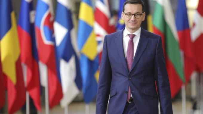 Polish Prime Minister Mateusz Morawiecki, left, arrives for an EU summit at the Europa building in Brussels on Thursday, Dec. 14, 2017. European Union leaders are gathering in Brussels and are set to move Brexit talks into a new phase as pressure mounts on Prime Minister Theresa May over her plans to take Britain out of the 28-nation bloc. (AP Photo/Olivier Matthys)