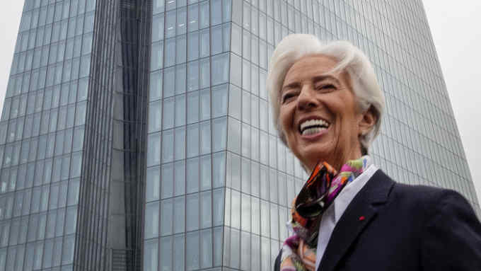New President of European Central Bank Christine Lagarde talks to media people in front of the ECB building before she takes office in Frankfurt, Germany, Monday, Nov. 4, 2019. (AP Photo/Michael Probst)