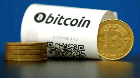 A Bitcoin (virtual currency) paper wallet with QR codes and a coin